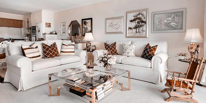 Living room with multiple lamps providing even lighting.